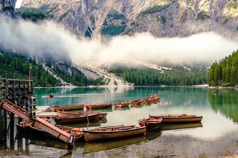 Wooden rowing boats on the turquoise water of Lake Braies